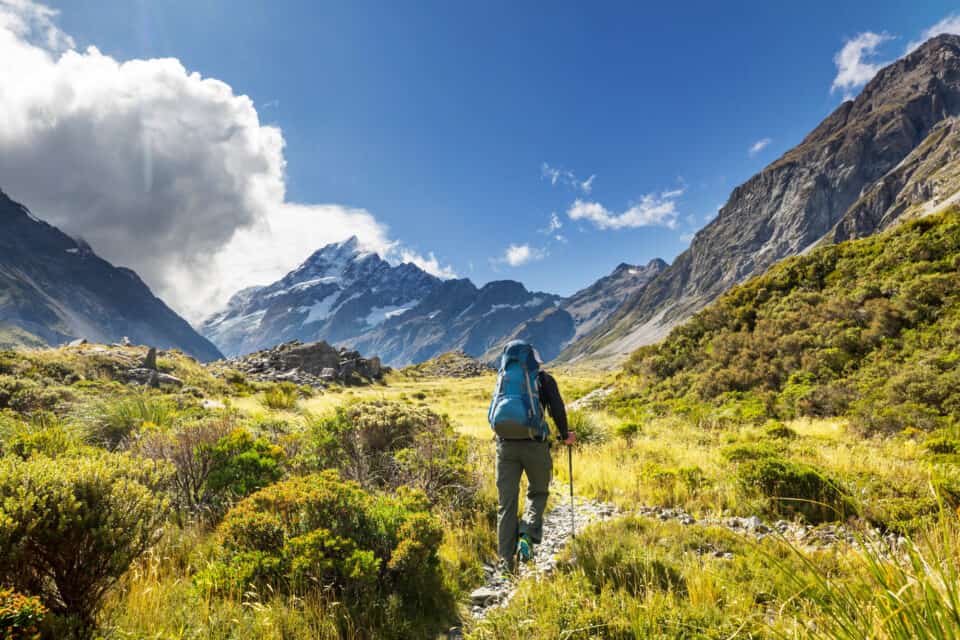 Man hiking in New Zealand near Mount Cook